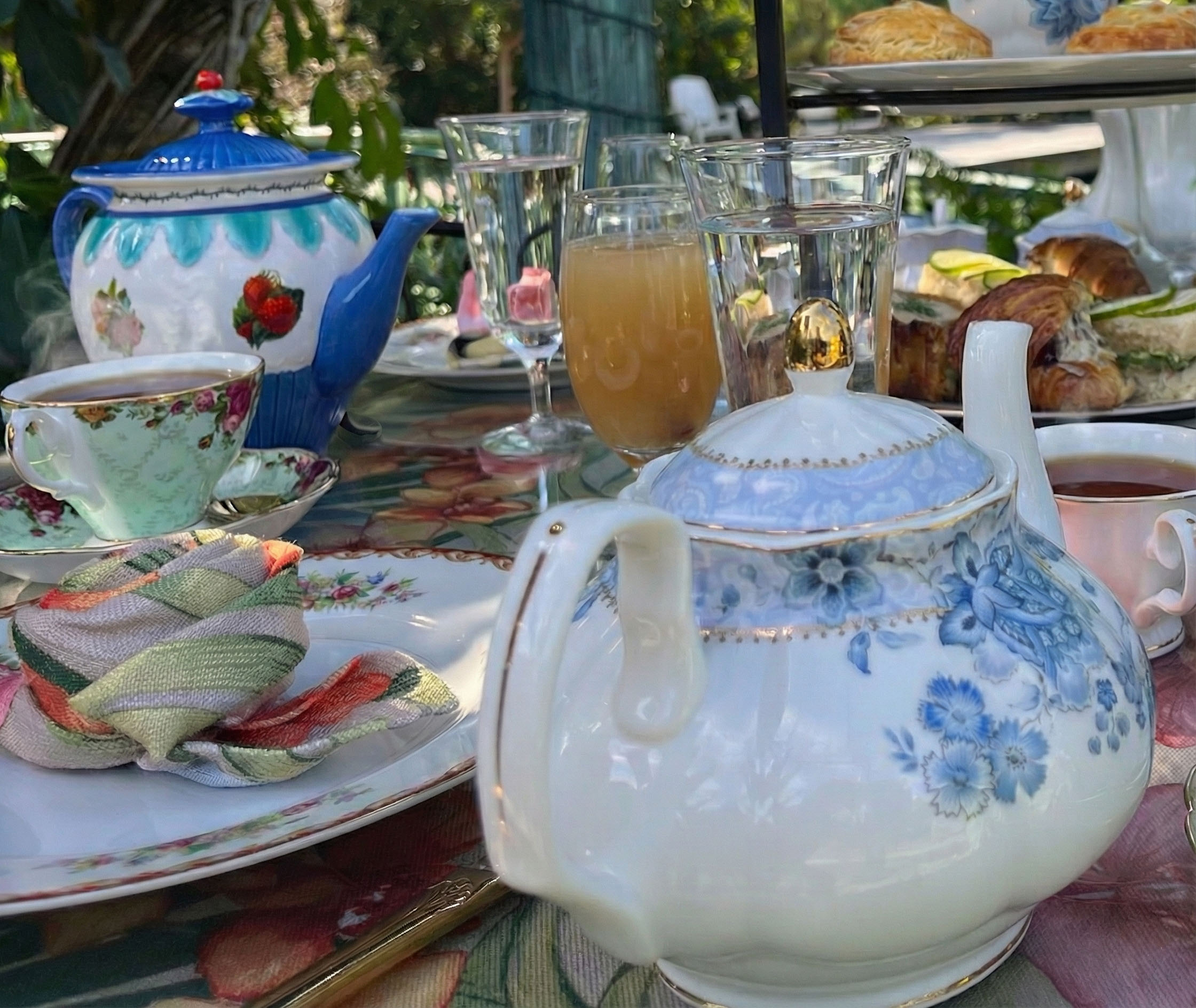 Elegant tea service with teapots and refreshments